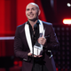 Pitbull accepts the Latin AMA Dick Clark Achievement Award at the Latin American Music Awards at the Dolby Theatre on Oct. 26, 2017, in Los Angeles. (Chris Pizzello/Invision/AP Images)